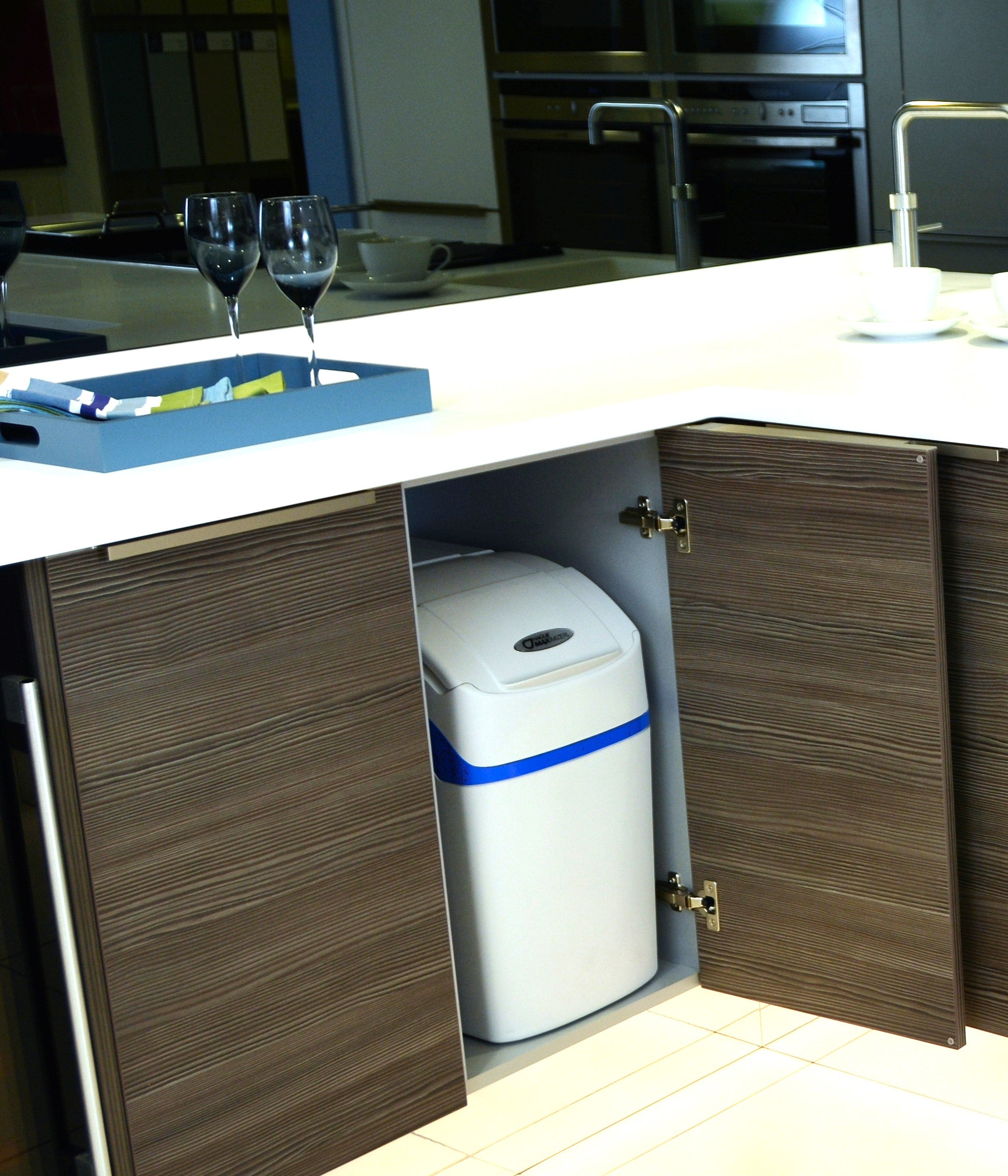Water softener in cupboard